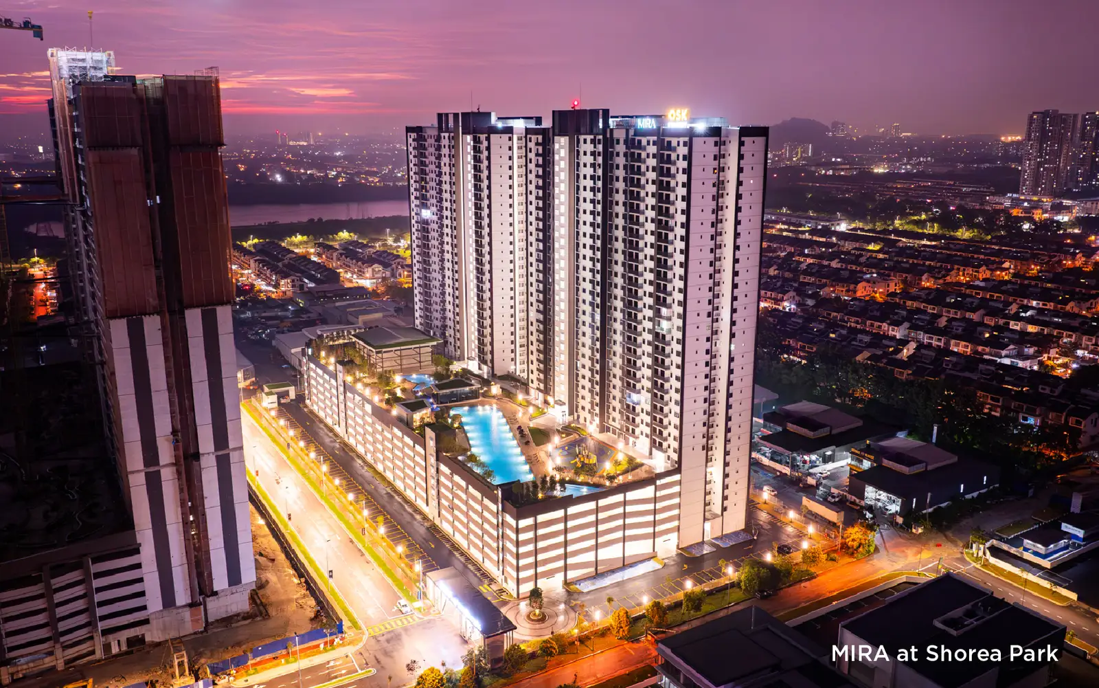 Aerial dusk photograph of the completed Mira at Shorea Park towers